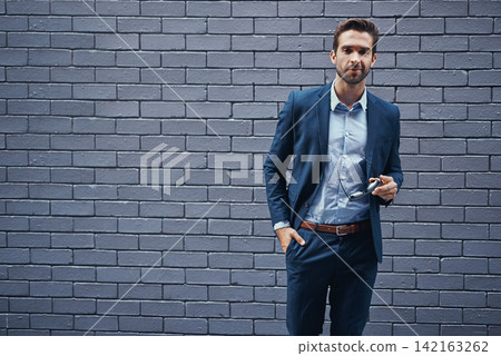 Fashionable, man and wall in suit with portrait for fashion, style and trendy in outdoor. Male person, pride and confidence in street for work, corporate or career with sunglasses in grey background Fashionable, man and wall in suit with portrait for fashion, style and trendy in outdoor. Male person, pride and confidence in street for work, corporate or career with sunglasses in grey background 142163262