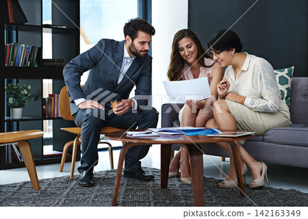 Business people, team and meeting with documents for project planning, brainstorming or discussion at office. Group of happy employees with paperwork for collaboration, report or review at workplace Business people, team and meeting with documents for project planning, brainstorming or discussion at office. Group of happy employees with paperwork for collaboration, report or review at workplace 142163349