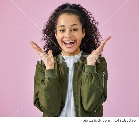 Portrait, wow and smile with woman on pink background in studio for reaction to good news. Emoji, hands and omg surprise with happy person in celebration for announcement of promotion or success Portrait, wow and smile with woman on pink background in studio for reaction to good news. Emoji, hands and omg surprise with happy person in celebration for announcement of promotion or success 142163350