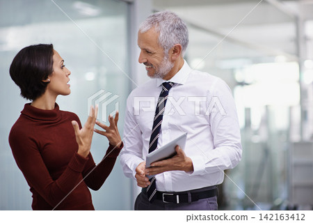Discussion, mentor and business woman with tablet in workplace for feedback, review or communication. Synergy, manager and female worker with technology for support, consult or advice in office Discussion, mentor and business woman with tablet in workplace for feedback, review or communication. Synergy, manager and female worker with technology for support, consult or advice in office 142163412