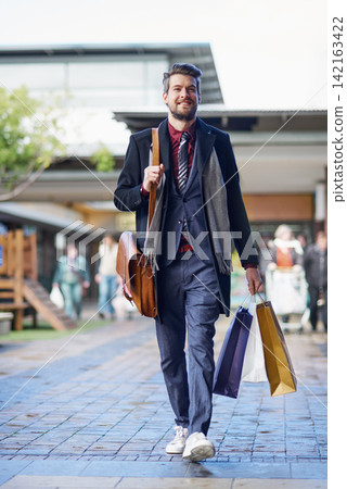 Shopping, man and happy in mall for fashion, retail therapy and satisfaction in market with budget. Male person, smiling and on break from work, business or trading in center for sale, deal or luxury Shopping, man and happy in mall for fashion, retail therapy and satisfaction in market with budget. Male person, smiling and on break from work, business or trading in center for sale, deal or luxury 142163422