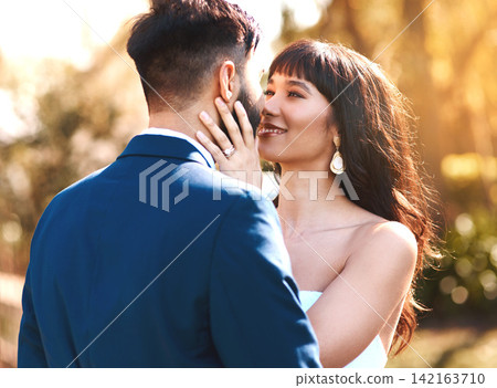 Love, face and couple at sunset in wedding for celebration of marriage and happiness. Bride, groom and people show care and support in romantic commitment with luxury outdoor event in summer Love, face and couple at sunset in wedding for celebration of marriage and happiness. Bride, groom and people show care and support in romantic commitment with luxury outdoor event in summer 142163710