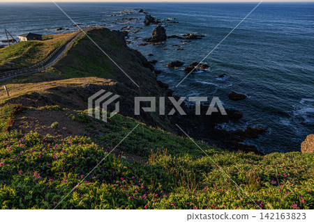 The lush green plateau of Cape Erimo in the Hidaka Mountains Erimo-Tokachi National Park and the walking trails leading to the Pacific Ocean The lush green plateau of Cape Erimo in the Hidaka Mountains Erimo-Tokachi National Park and the walking trails leading to the Pacific Ocean 142163823