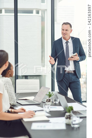 Meeting, mature man or ceo with business people in office for company update, task or conversation. Corporate strategy, staff or boss with speech, communication or leadership in workplace with tablet Meeting, mature man or ceo with business people in office for company update, task or conversation. Corporate strategy, staff or boss with speech, communication or leadership in workplace with tablet 142163897