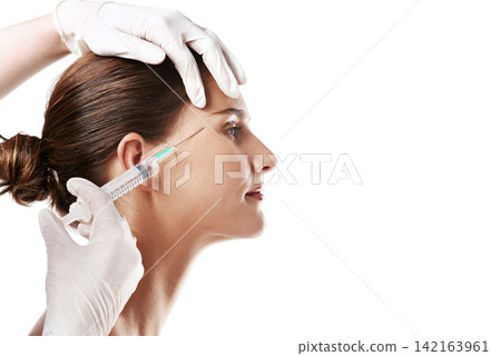 Woman, beauty and dermatology with syringe for anti aging, needle and cosmetics or skincare by white background. Patient, injection and facelift in studio for filler with results, collagen and glow Woman, beauty and dermatology with syringe for anti aging, needle and cosmetics or skincare by white background. Patient, injection and facelift in studio for filler with results, collagen and glow 142163961