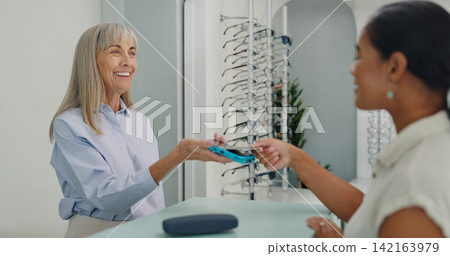 Shopping, credit card and people with contactless payment for retail service and eye care at store. Tap, machine and optometrist with customer with bank purchase transaction at optical shop. Shopping, credit card and people with contactless payment for retail service and eye care at store. Tap, machine and optometrist with customer with bank purchase transaction at optical shop. 142163979