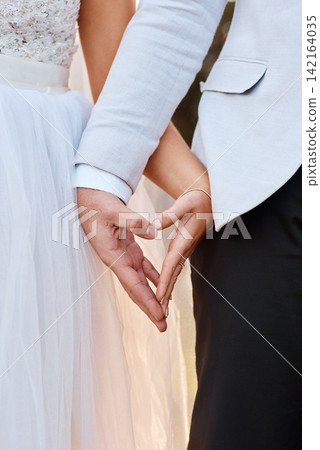 Wedding, couple and holding hands with love in heart or partnership with kindness and care. Engagement, marriage and people together at event for commitment with respect, gratitude and support Wedding, couple and holding hands with love in heart or partnership with kindness and care. Engagement, marriage and people together at event for commitment with respect, gratitude and support 142164035