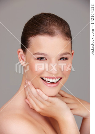 Skincare, cosmetics and portrait of woman in studio for dermatology, wellness or facial treatment with gray background. Beauty, smile and female model for healthy skin, makeup or natural glow Skincare, cosmetics and portrait of woman in studio for dermatology, wellness or facial treatment with gray background. Beauty, smile and female model for healthy skin, makeup or natural glow 142164138
