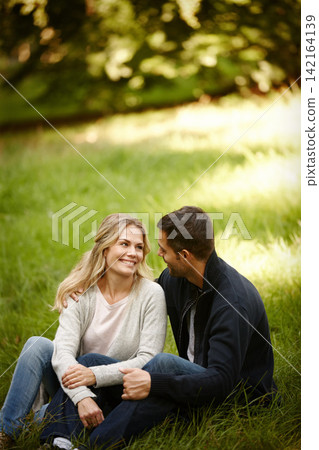 Couple, embrace and outdoor love on grass, together and care in relationship or bonding in park. Happy people, support and hug on holiday or vacation in nature, relax and commitment on romance date Couple, embrace and outdoor love on grass, together and care in relationship or bonding in park. Happy people, support and hug on holiday or vacation in nature, relax and commitment on romance date 142164139