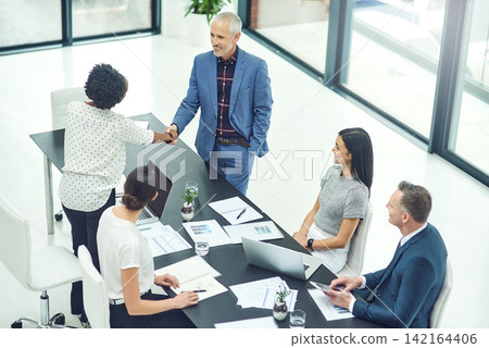 Business, people and handshake for meeting in office, welcome and greeting with hand gesture. Agreement, deal and employees for b2b contract, boardroom and professional workplace with company staff Business, people and handshake for meeting in office, welcome and greeting with hand gesture. Agreement, deal and employees for b2b contract, boardroom and professional workplace with company staff 142164406