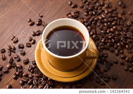 coffee poured into a cup coffee poured into a cup 142164541