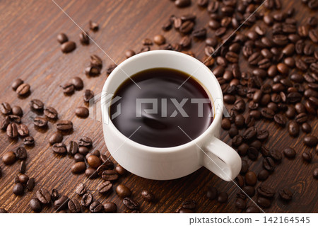 coffee poured into a cup coffee poured into a cup 142164545