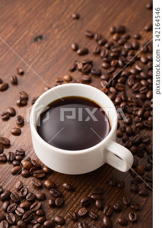 coffee poured into a cup coffee poured into a cup 142164546