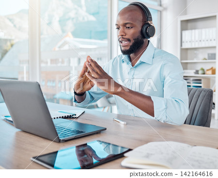 Black man, headphones and video call on laptop in office, remote meeting and virtual conference. Person, talking and internet or online app for conversation, company seminar and speaking to contact Black man, headphones and video call on laptop in office, remote meeting and virtual conference. Person, talking and internet or online app for conversation, company seminar and speaking to contact 142164616