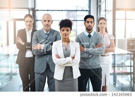 Office, team and portrait of business people with arms crossed for leadership, collaboration and pride. Diversity, company and serious employee with confidence for career, commitment and partnership 142165063