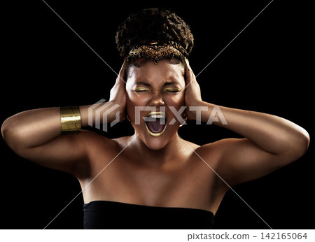 Noise, scream and black woman with gold jewelry for fashion, beauty or makeup crown for luxury isolated on dark background. African queen, expression or accessories for culture, wealth or cosmetics Noise, scream and black woman with gold jewelry for fashion, beauty or makeup crown for luxury isolated on dark background. African queen, expression or accessories for culture, wealth or cosmetics 142165064