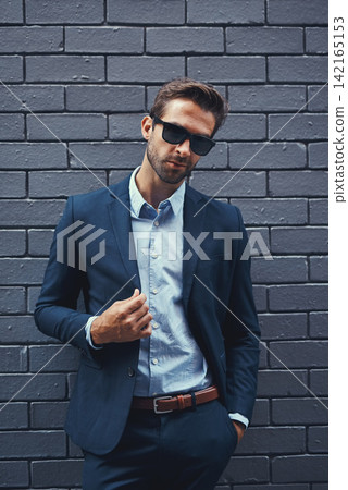Male model, wall and fashion with suit or confident for clothing, sunglasses or trendy and cool. Businessman, backdrop and stylish or formal for career with corporate, lawyer with hands in Chicago Male model, wall and fashion with suit or confident for clothing, sunglasses or trendy and cool. Businessman, backdrop and stylish or formal for career with corporate, lawyer with hands in Chicago 142165153