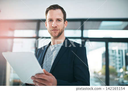 Businessman, office and tablet in portrait with smile in confidence with tech for analyst job. Male person, workplace and notepad in company with analytics for business with pride, digital and career Businessman, office and tablet in portrait with smile in confidence with tech for analyst job. Male person, workplace and notepad in company with analytics for business with pride, digital and career 142165154