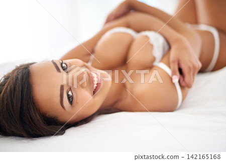 Portrait, bed and lingerie with woman, smile and confidence with break and morning with beauty. Person, home and girl in underwear and calm with blanket and relaxing with health, resting or seductive Portrait, bed and lingerie with woman, smile and confidence with break and morning with beauty. Person, home and girl in underwear and calm with blanket and relaxing with health, resting or seductive 142165168