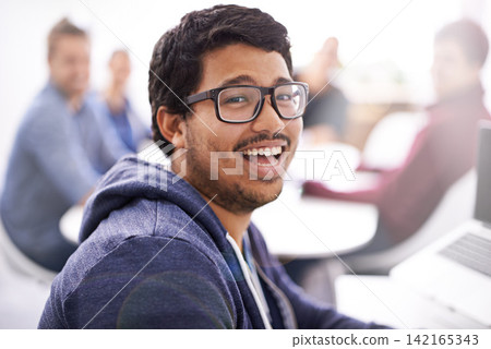 Meeting, happy and portrait of business man in creative office for planning, collaboration or internship. Lens flare, designer or young worker with glasses for solution, teamwork and startup project Meeting, happy and portrait of business man in creative office for planning, collaboration or internship. Lens flare, designer or young worker with glasses for solution, teamwork and startup project 142165343