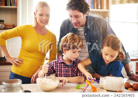 Mother, father and children in kitchen baking cookies for learning, development and bonding as family. Mom, dad and kids mixing ingredients for desserts, pastries or biscuits and cake together Mother, father and children in kitchen baking cookies for learning, development and bonding as family. Mom, dad and kids mixing ingredients for desserts, pastries or biscuits and cake together 142165405