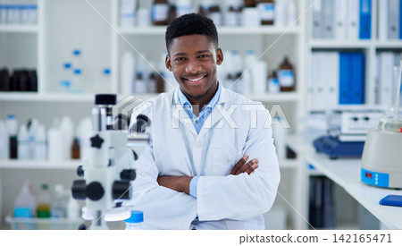 Science, man and portrait in lab with arms crossed for medical research, microscopic experiment or DNA testing. Scientist, african expert and confidence for gene editing and healthcare breakthrough Science, man and portrait in lab with arms crossed for medical research, microscopic experiment or DNA testing. Scientist, african expert and confidence for gene editing and healthcare breakthrough 142165471
