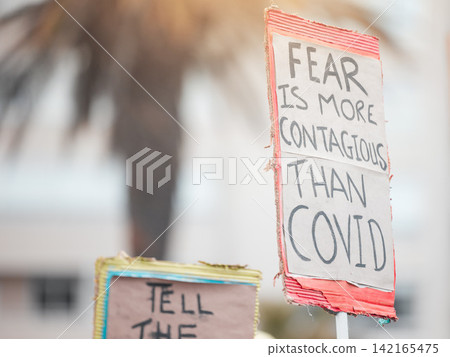 Protesters, sign and covid or demonstration with board, slogan and beliefs for fight against political views on medical vaccine. Poster, human rights and activism for government, justice and rally 142165475