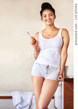 Smile, oral care and portrait of woman with toothbrush in bathroom for morning hygiene routine. Happy, wellness and female person with dental product for plaque, gums and fresh breath at home. Smile, oral care and portrait of woman with toothbrush in bathroom for morning hygiene routine. Happy, wellness and female person with dental product for plaque, gums and fresh breath at home. 142165484