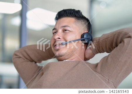 Happy man, relax and call centre with headphone for customer service, support and telemarketing in office. Male employee, consultant and help, support and advice from crm on hotline for communication Happy man, relax and call centre with headphone for customer service, support and telemarketing in office. Male employee, consultant and help, support and advice from crm on hotline for communication 142165543
