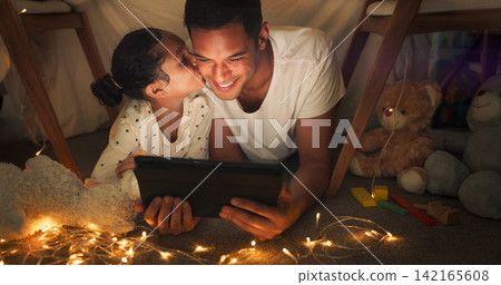 Happy, tablet and child kiss father in playhouse or tent at night for storytelling, ebook or internet at home. Excited parent, family and girl with love and bonding in bedroom and digital technology Happy, tablet and child kiss father in playhouse or tent at night for storytelling, ebook or internet at home. Excited parent, family and girl with love and bonding in bedroom and digital technology 142165608