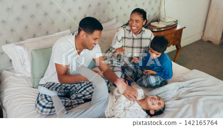 Happy family, bed and playing with kids for love, bonding or fun morning together at the house. Mother, father and playful children with smile for crazy games, laughter or goofy parents in bedroom Happy family, bed and playing with kids for love, bonding or fun morning together at the house. Mother, father and playful children with smile for crazy games, laughter or goofy parents in bedroom 142165764