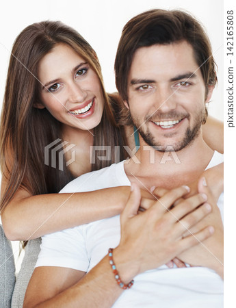 Smile, hug and portrait of couple in studio together with romance, commitment and marriage support. Love, man and happy woman embrace with relationship trust, care and partnership on white background Smile, hug and portrait of couple in studio together with romance, commitment and marriage support. Love, man and happy woman embrace with relationship trust, care and partnership on white background 142165808