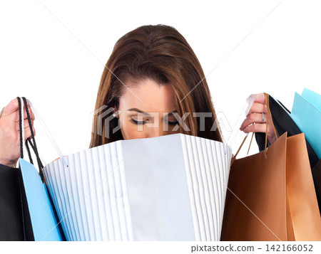 Woman, checking and shopping with bags for clothes, fashion and luxury in studio. Female person, looking and retail for style, designer and sale on isolated white background with mockup in store 142166052
