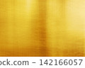 A gold metallic texture background with a soft sheen and reflection. 142166057