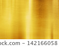 A gold metallic texture background with a soft sheen and reflection. 142166058