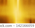 A gold metallic texture background with a soft sheen and reflection. 142166059