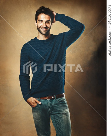 Portrait, proud and man in studio, sweater and warm in winter, confidence and fashion for aesthetic. Smile, person and background of wall, model and cool with trend, stylish and jersey for clothes Portrait, proud and man in studio, sweater and warm in winter, confidence and fashion for aesthetic. Smile, person and background of wall, model and cool with trend, stylish and jersey for clothes 142166572