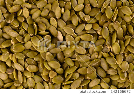 Close-Up Heap of Raw Pumpkin Seeds Close-Up Heap of Raw Pumpkin Seeds 142166672