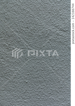 Textured gray wall showcasing intricate patterns and subtle variations under soft lighting Textured gray wall showcasing intricate patterns and subtle variations under soft lighting 142166744