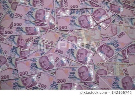 Abundance of colorful banknotes spread across table showcasing Turkish currency Abundance of colorful banknotes spread across table showcasing Turkish currency 142166745