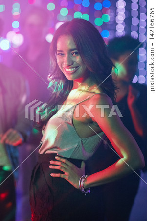 Woman, portrait and confident in nightclub for new years eve, birthday and party or disco in Mexico. Smile, dancer and fashion in festival for concert, dancing and celebration on dance floor in city 142166765