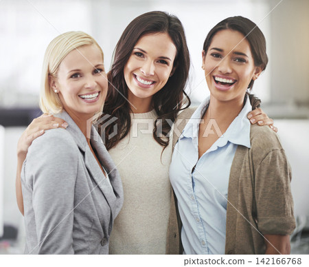 Women, hug and professional portrait in office with support and teamwork on project in Australia with happiness. Work, friends or employees with solidarity on collaboration or group laughing together Women, hug and professional portrait in office with support and teamwork on project in Australia with happiness. Work, friends or employees with solidarity on collaboration or group laughing together 142166768