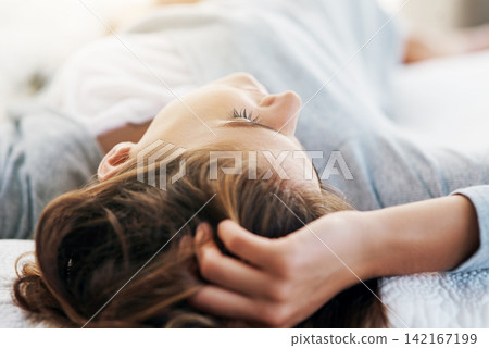 Sleeping, morning and woman in bed in home for relaxing, resting and wake up from dreaming. Bedroom, house and closeup of person with blanket on weekend, vacation and break for comfortable nap 142167199
