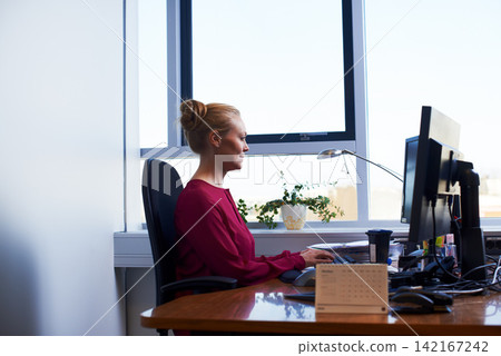 Business woman, typing and working on computer at office desk for planning and email management. Secretary, worker or employee on desktop for online workflow and productivity or busy by calendar Business woman, typing and working on computer at office desk for planning and email management. Secretary, worker or employee on desktop for online workflow and productivity or busy by calendar 142167242