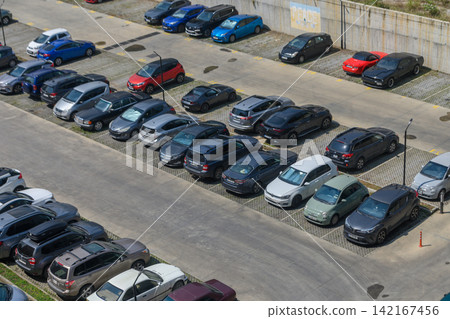 August 13, 2026, Tbilisi, Georgia High-angle aerial shot of a large outdoor parking lot filled with various parked cars August 13, 2026, Tbilisi, Georgia High-angle aerial shot of a large outdoor parking lot filled with various parked cars 142167456