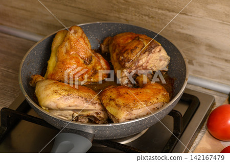 Cooking tender chicken pieces in a skillet, releasing mouthwatering aromas and inviting flavors Cooking tender chicken pieces in a skillet, releasing mouthwatering aromas and inviting flavors 142167479