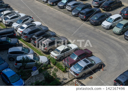 August 13, 2026, Tbilisi, Georgia High-angle aerial shot of an outdoor parking lot filled with various cars August 13, 2026, Tbilisi, Georgia High-angle aerial shot of an outdoor parking lot filled with various cars 142167496