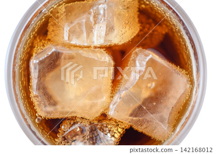 Top view of cola or carbonated soft drink with ice cubes in glass Top view of cola or carbonated soft drink with ice cubes in glass 142168012