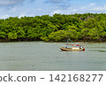 Small rustic fishing boat 142168277