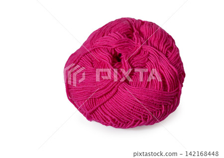 Vibrant pink ball of yarn resting on a clean, white surface for creative crafting and artistic expression Vibrant pink ball of yarn resting on a clean, white surface for creative crafting and artistic expression 142168448